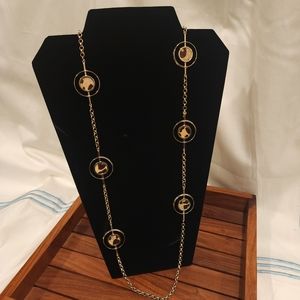 Chico's 45" necklace with 6 circles of faux cow hide. Circles are 1"